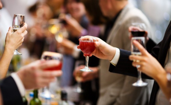 Holiday company Event people cheering each other with champagne and wine