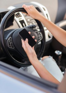 Modisette, woman using phone while driving the car