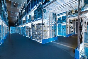 Interior of a huge spacious warehouse with carton boxes