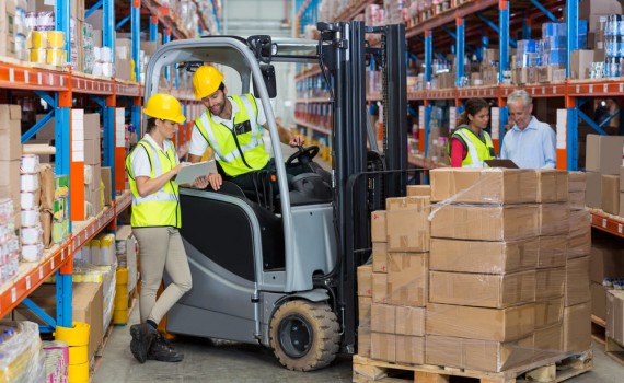 View of workers are working together in a warehouse