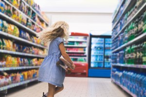 Girl on Skateboard in Store