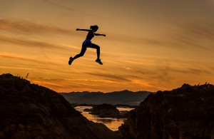 woman jumping and hiking