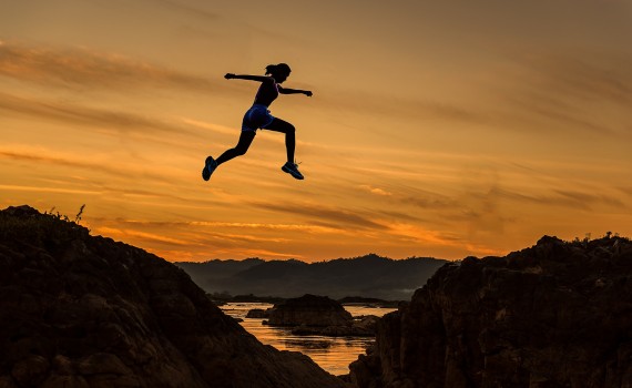 woman jumping and hiking
