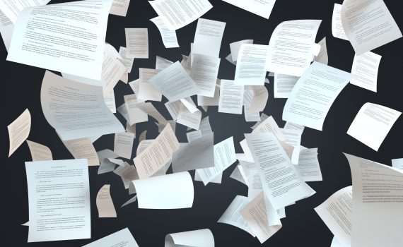 papers falling on a black background