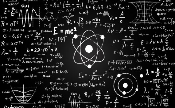 Blackboard inscribed with scientific formulas and calculations