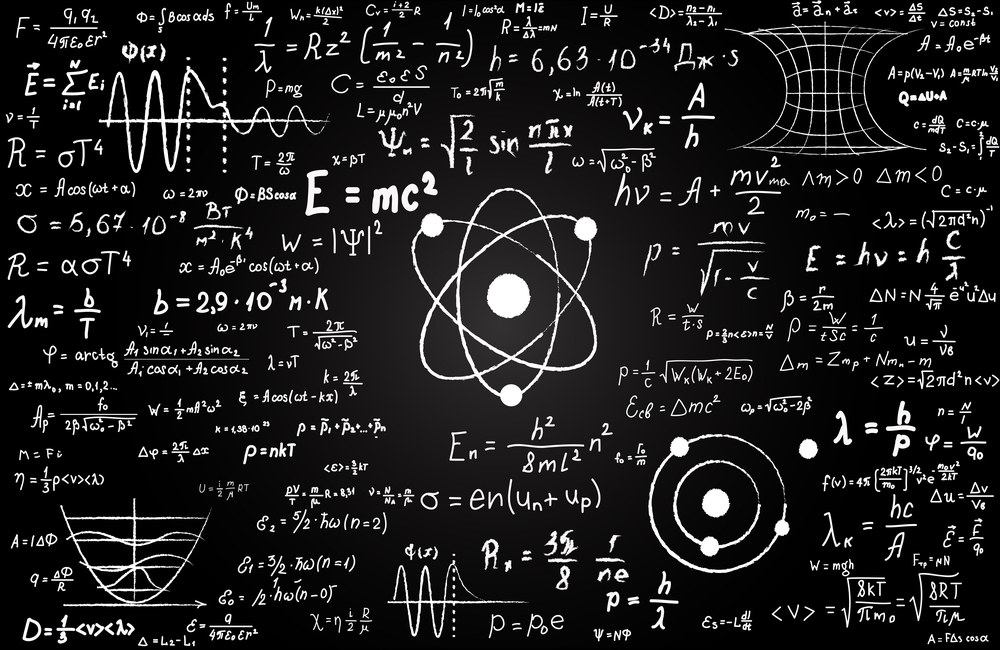 Blackboard inscribed with scientific formulas and calculations