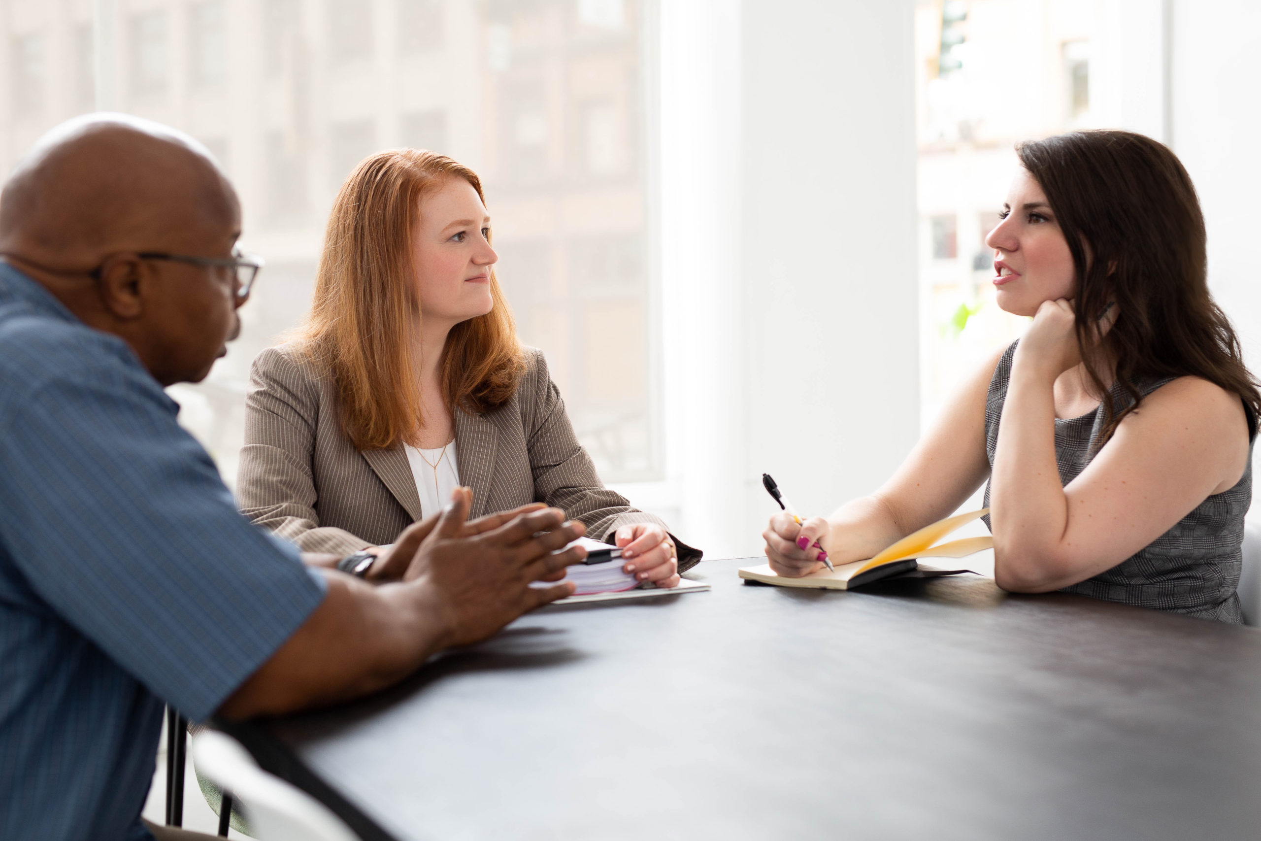 LLC and Business Disputes Attorney Stacia Hofmann Discussing Matter With Cliens